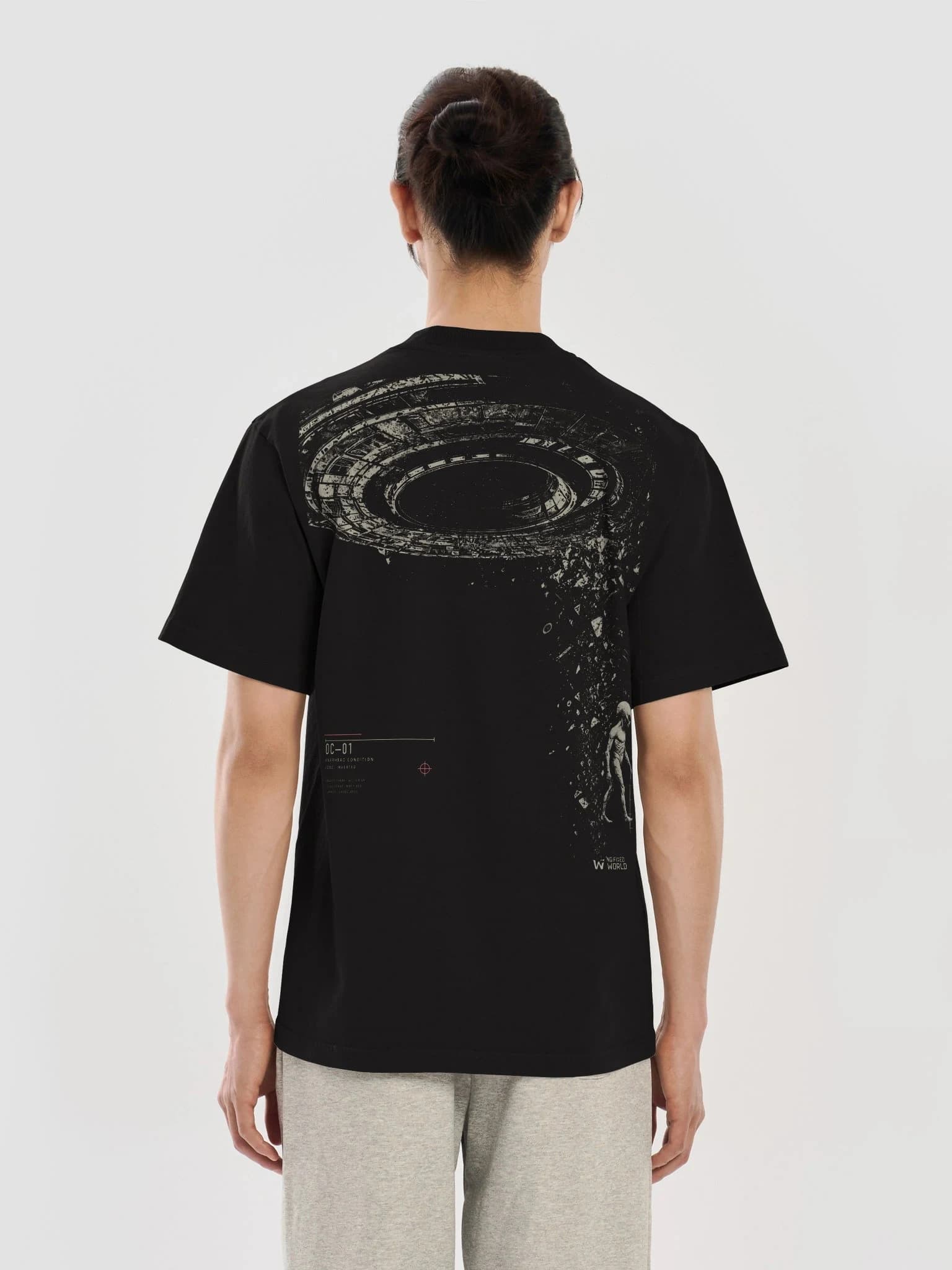 On-body back view of the Overhead Condition black heavyweight graphic tee