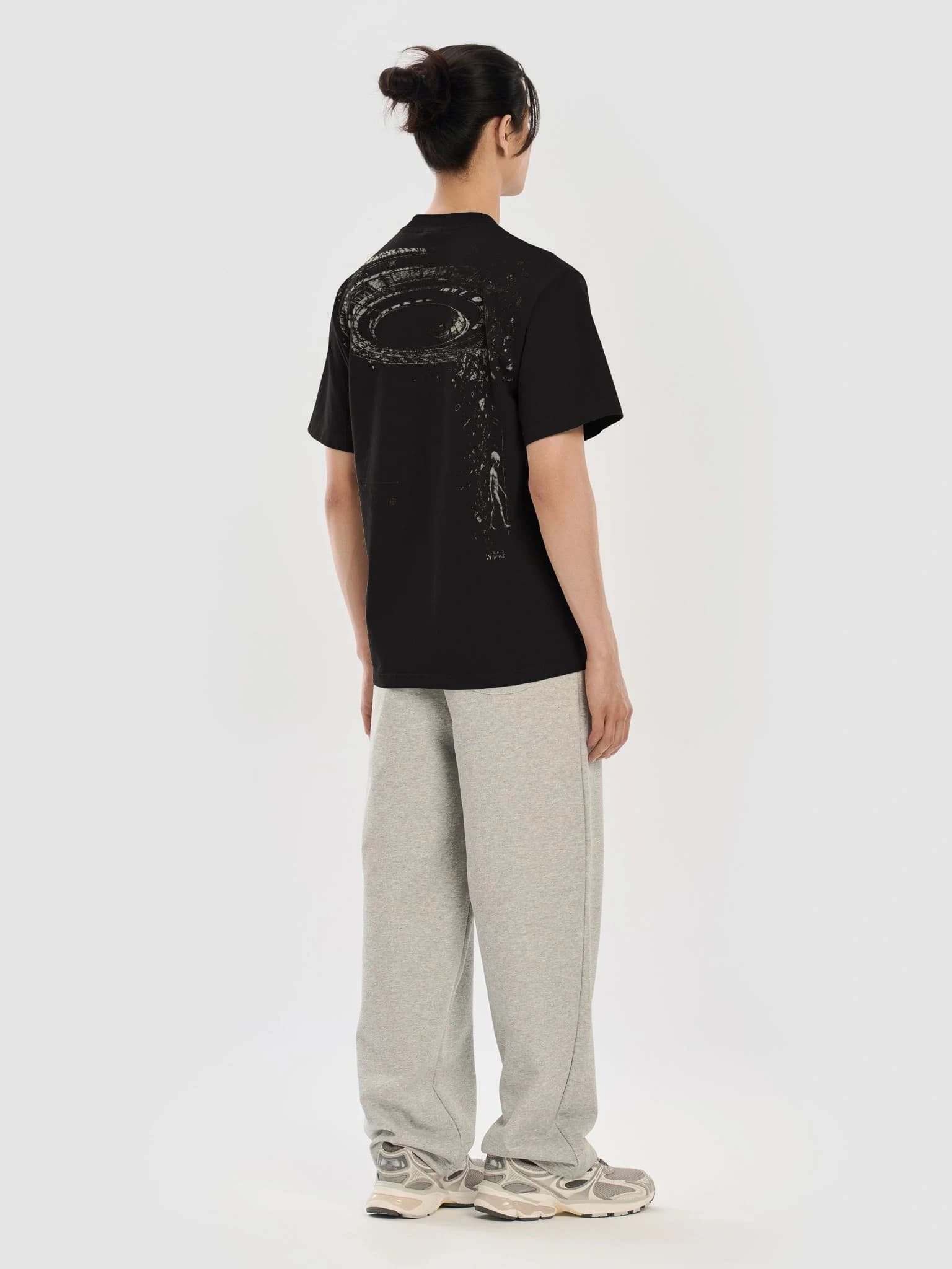 Three-quarter back view of the Overhead Condition black heavyweight graphic tee